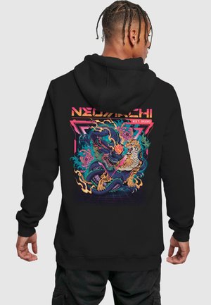 Black hoodie featuring a vibrant graphic of a dragon and tiger intertwined in flames, with colorful accents and retro elements.