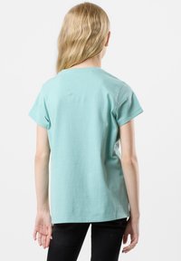 Mint green short-sleeve cotton t-shirt with a round neckline and a straight cut, shown from the back.