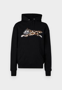 Sweatshirt à capuche noire avec un motif léopard et un visage de dessin animé exagéré, poche avant, et capuche avec cordon de serrage.