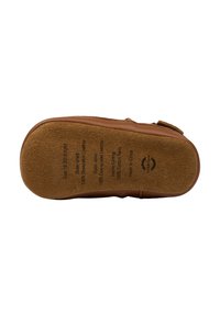 Semelle en cuir brun avec une texture en suédine douce, présentant des détails de taille et de matériau imprimés à la surface.