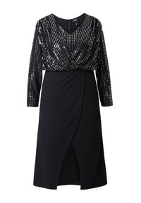 Černé šaty s třpytivým topem s dlouhými rukávy, výstřihem do V a přiléhavou sukní se zavinovacím designem a rozparkem až po kolena.