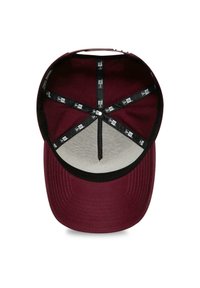 Maroon cap with a black brim, featuring a textured interior lining and mesh panel. Includes black fabric adjusters and a central stitching point.