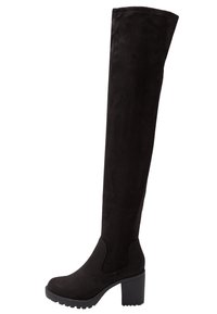 Las botas de ante negro hasta la rodilla presentan un tacón ancho, punta redonda ajustada y una superficie texturizada, con paneles laterales de elastano para mayor comodidad.