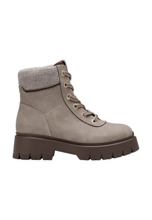 Beiger Schnürstiefel mit dicker brauner Profilsohle und weichem wollartigem Schaftrand, seitlich gezeigt.