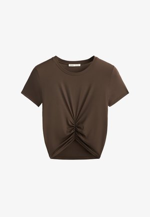 Brown short-sleeve t-shirt with a gathered knot detail at the front bottom hem. Made of smooth fabric, it features a classic crew neckline.