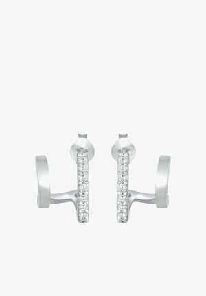 Srebrni obročasti uhani s polirano površino, ki imajo spredaj vrsto majhnih, prozornh draguljev. Preprost in eleganten dizajn.