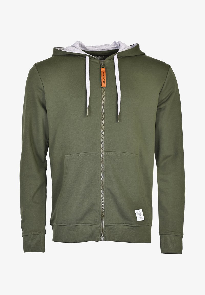 Oliwkowy hoodie na zamek z szarym wykończeniem kaptura, białymi sznurkami, kieszeniami z przodu i małą metką z logo na dole. Miękki materiał.