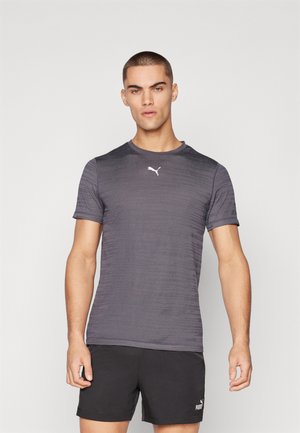 Gray athletic t-shirt with short sleeves, featuring a textured pattern and a white Puma logo on the chest. Paired with black shorts.