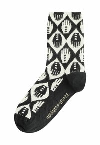 Calcetines con un patrón de manos en blanco y negro dentro de formas de diamante. Textura acanalada, talón y puntera reforzados. Nombre de la marca en la suela.
