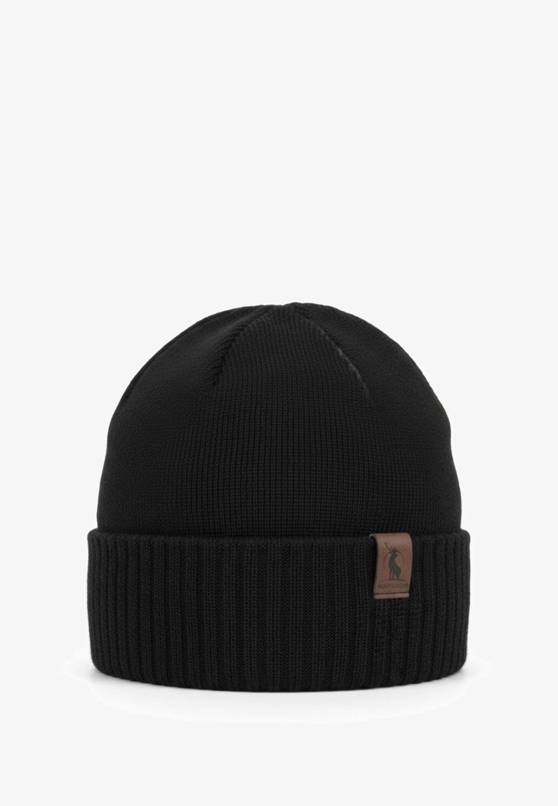 Cappellino nero in maglia con risvolto a coste. Presenta un'etichetta in pelle marrone con il logo. Realizzato in tessuto flessibile e testurizzato per mantenere il calore.