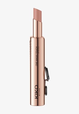 Conteneur à lèvres en métal rose doré avec un dessus incliné, arborant un marquage gravé et un mécanisme à vis pour l'application.