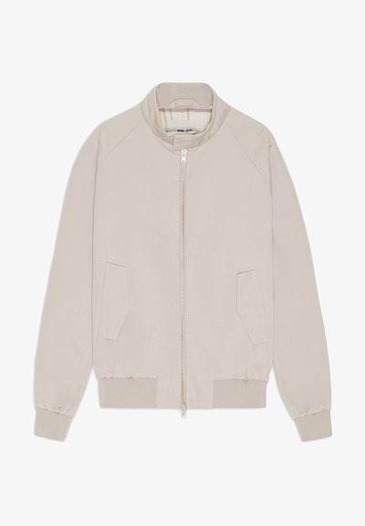 Beige bomberjacka med dragkedja, ribbade muddar och nederkant samt två sidofickor. Slät tyg med en minimalistisk design.