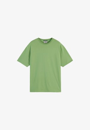 T-shirt in cotone verde con una vestibilità rilassata, maniche corte e colletto tondo. Presenta del testo sottile in verde chiaro sulla parte anteriore.
