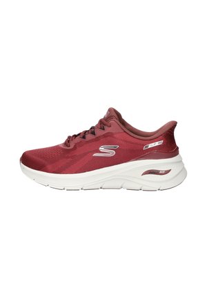 Side view of a red Skechers athletic shoe with white sole and black laces, featuring "Slip-Ins" and "Arch Fit" labels.