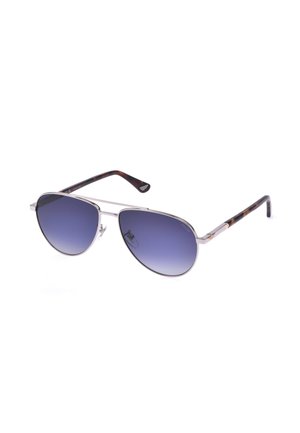 Lunettes de soleil style aviateur avec monture en métal argenté, verres dégradés bleus et branches marron motif écaille.