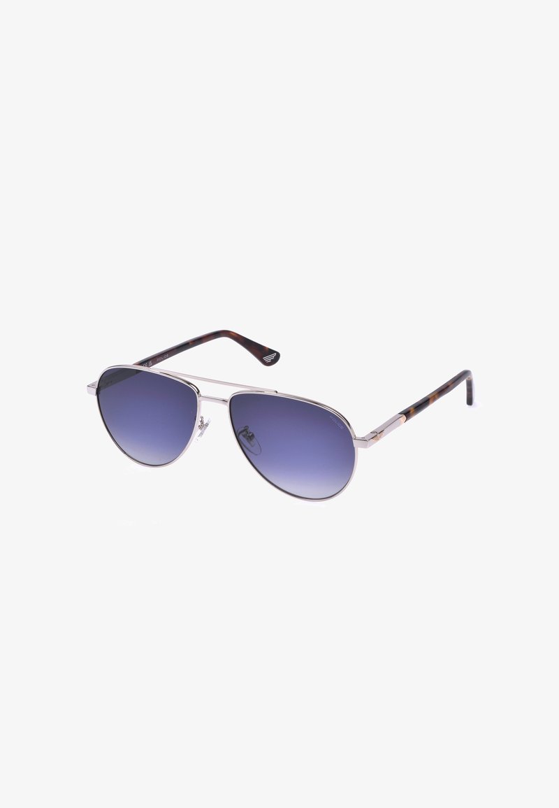 Lunettes de soleil style aviateur avec monture en métal argenté, verres dégradés bleus et branches marron motif écaille.
