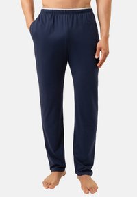 Donkerblauwe katoenen loungebroek met elastische tailleband, zijzakken en een ontspannen pasvorm, met een gladde textuur en recht model.