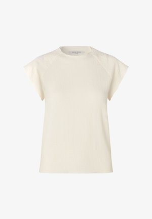 Bluzka z krótkim rękawem i okrągłym dekoltem w kolorze ecru, wykonana z tkaniny o fakturze. Posiada delikatne marszczenia na ramionach i luźny krój.