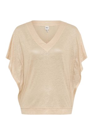 Beige short-sleeve sweater with V-neck and loose, draped fit, made of lightweight, semi-sheer fabric.