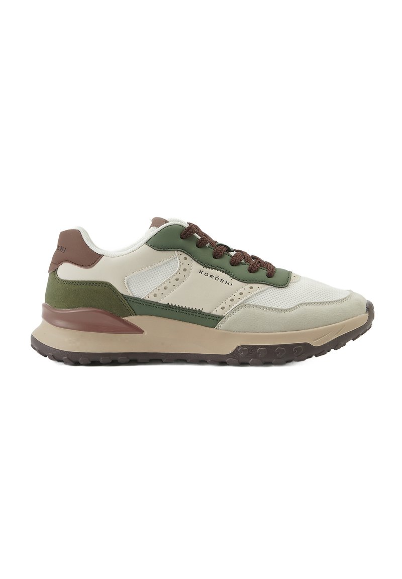 Heledad sneakers heledat roheliste ja pruunide aktsentidega, tekstureeritud võrkkude ja nahkmaterjalid, polsterdatud krae ning kummist talla muster, mis tagab hea haardumise.
