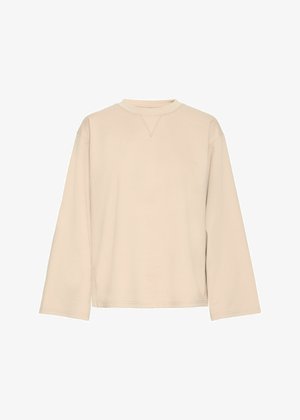 Sweatshirt long beige clair à manches longues avec un col rond et un détail de couture en V subtil. Tissu doux, coupe décontractée et manches larges.