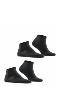 Schwarze Knöchelsocken aus geripptem Stoff. Sie haben eine enganliegende Bünne und eine glatte Textur, gestaltet in einer klassischen Form mit minimalistischen Details.