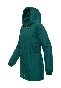 Giacca impermeabile verde scuro con cappuccio, polsini elasticizzati, vita regolabile e zip frontale. Tessuto liscio e design minimalista.