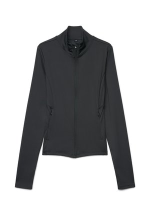 Giacca nera a maniche lunghe aderente con cerniera frontale e tasche laterali con zip, collo alto, mostrata distesa su sfondo bianco.