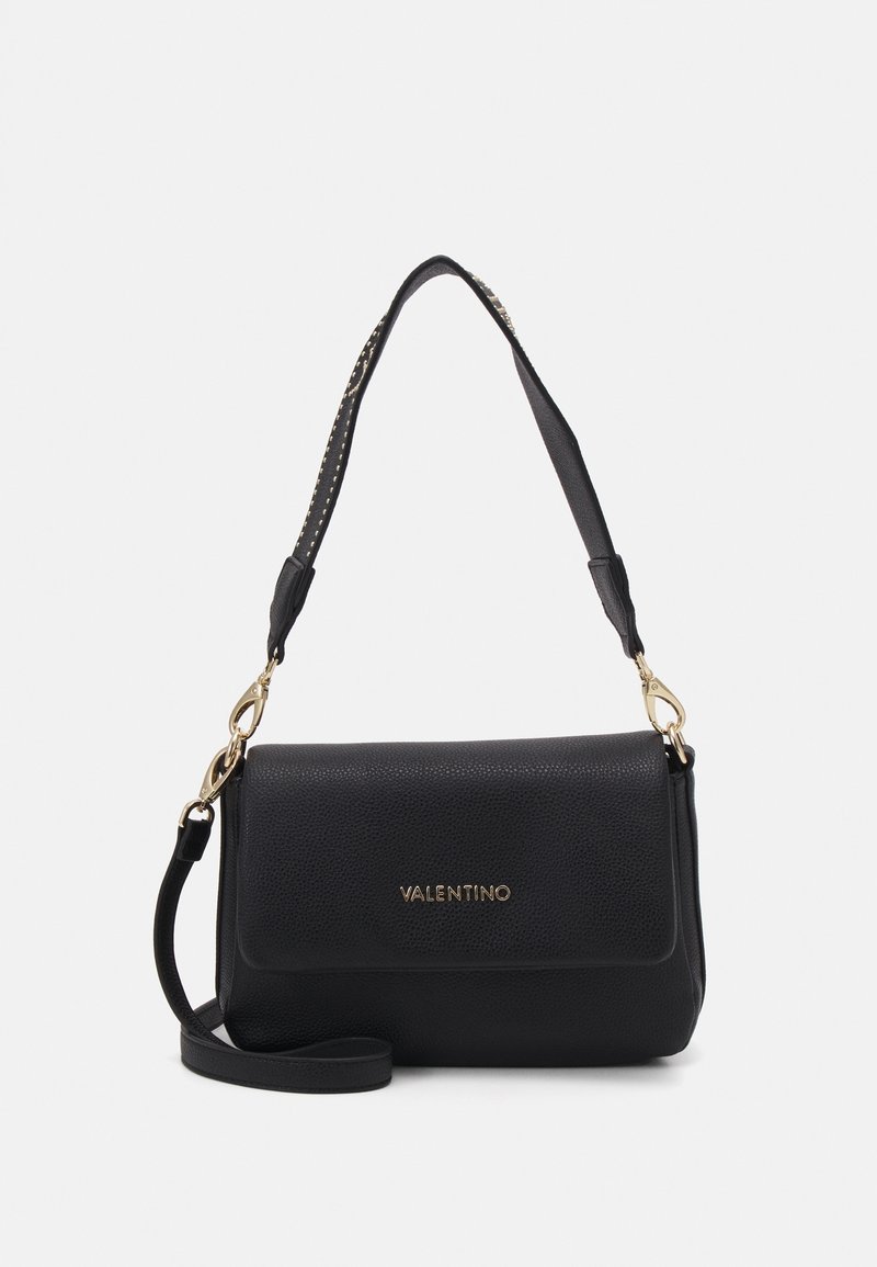 Black leather handbag with a textured finish, featuring a gold logo, detachable shoulder strap, and detailed hardware accents.