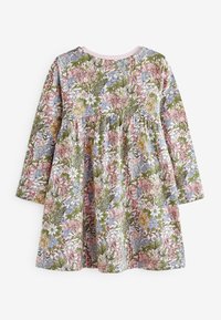Robe pour tout-petit à manches longues avec des bordures roses, recouverte d'un dense motif floral comprenant des feuilles et des fleurs dans des teintes pastel de rose, bleu, jaune et vert.