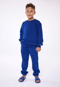 Champion EXCLUSIVE PANT UNISEX - Treniņtērpa apakšdaļas - dark blue