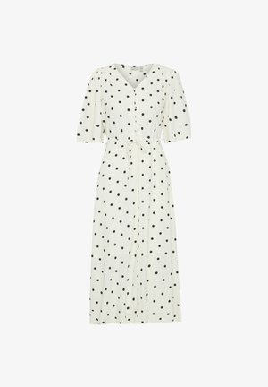 Vit midiklänning med svarta prickar, v-ringning, korta puffärmar, knytliv och knappringning fram.