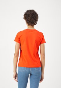 Levi's® Tričko s potlačou - orange
