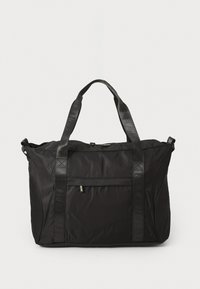 Black nylon tote bag with two textured straps, a front pocket, and subtle logo detail. Features a structured shape and durable finish.