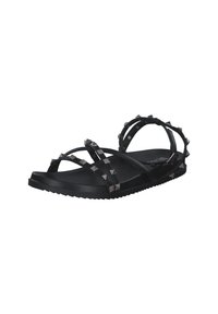 Black sandals featuring multiple crisscross straps, spiked accents, a flat sole, and a textured outsole for grip. Made of synthetic material.