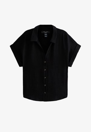 Chemise noire à manches courtes avec boutons, col et poignets retroussés, en tissu texturé, étiquette taille 18 UK.