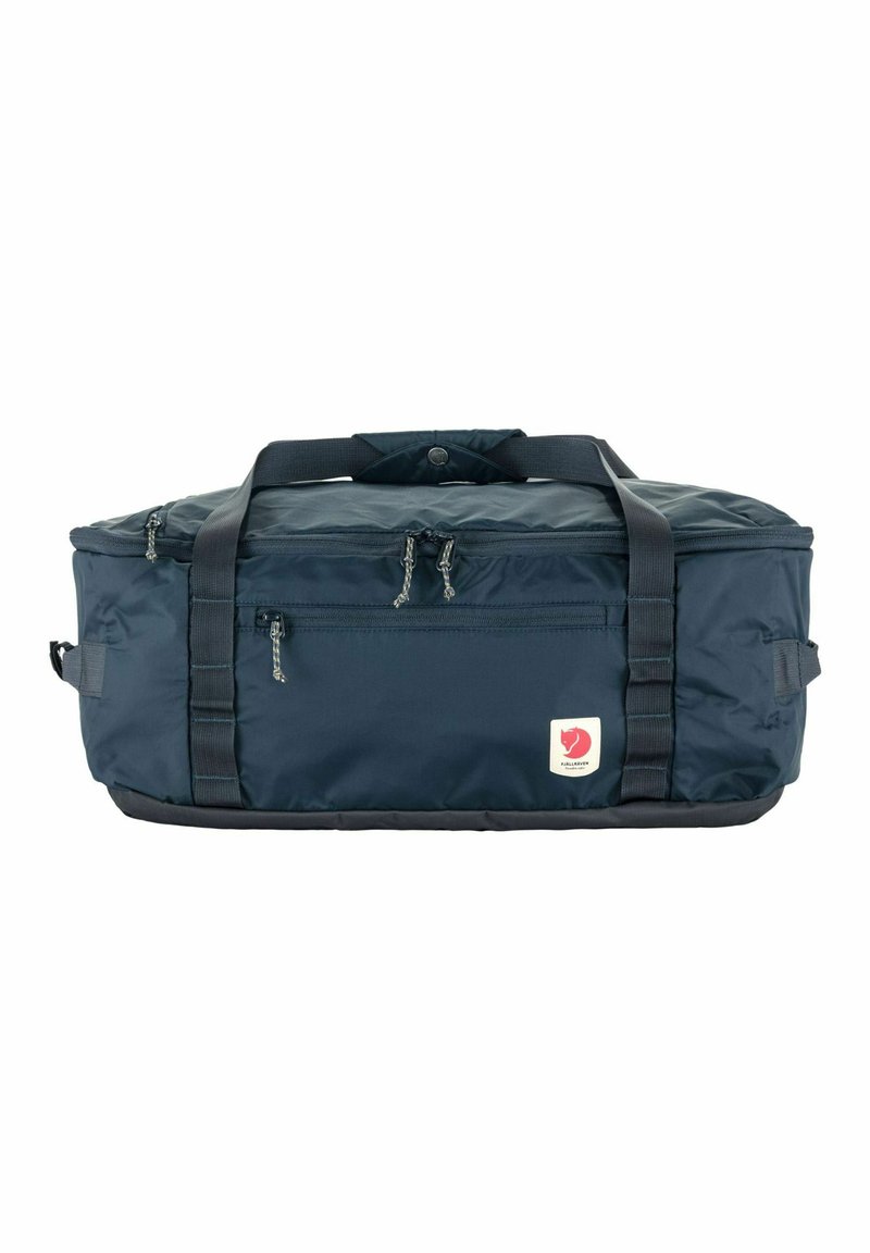 Borsa da viaggio blu navy realizzata in materiale sintetico, con manici rinforzati, doppia cerniera e una piccola etichetta con logo sul lato.