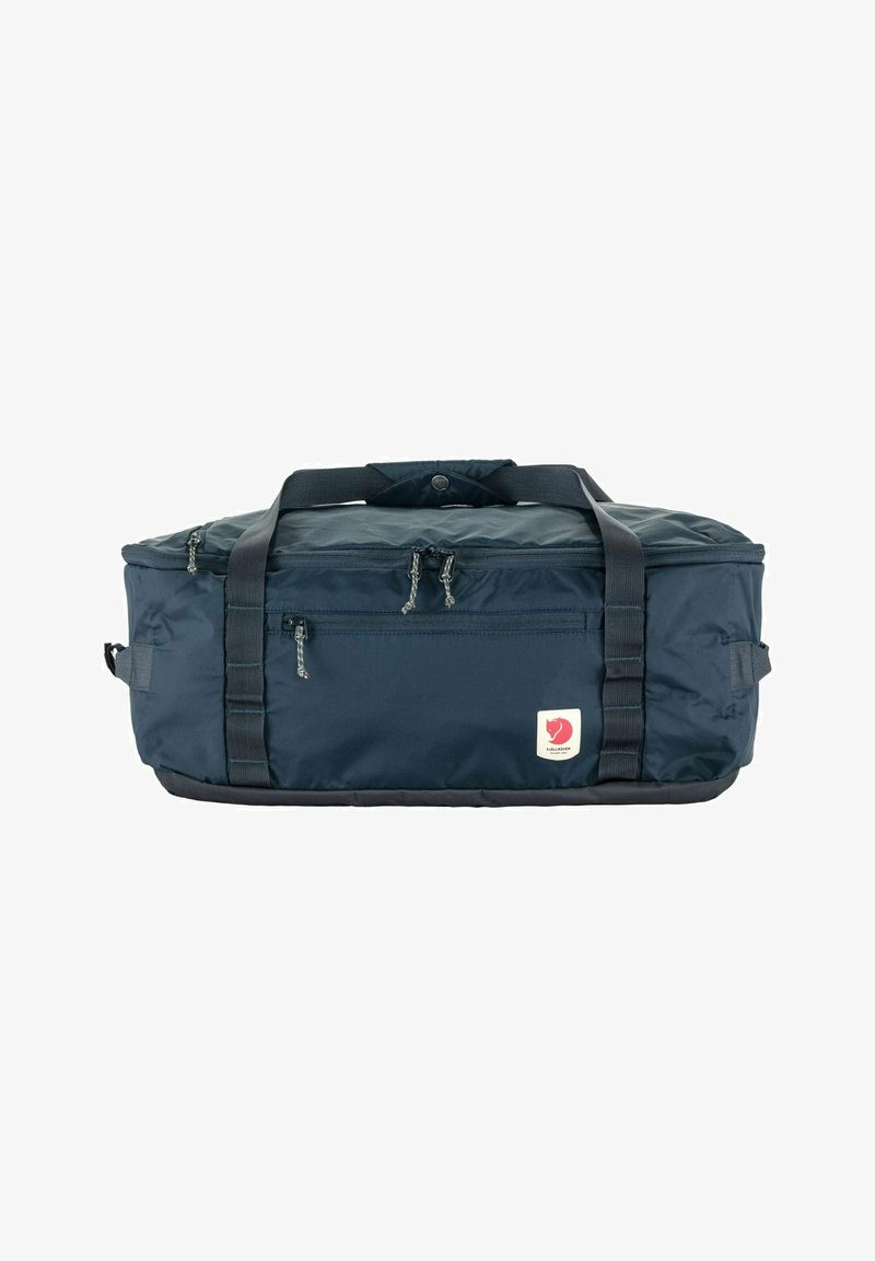 Saco de desporto azul marinho feito de material sintético, com alças reforçadas, zíperes duplos e um pequeno logótipo aplicado de lado.