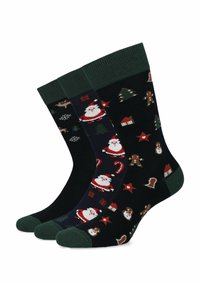 Zestaw trzech skarpetek w tematyce świątecznej, wykonanych z mieszanki bawełny, z wizerunkiem Świętego Mikołaja, choinek i gwiazd w ciemnych kolorach z zielonymi ściągaczami.