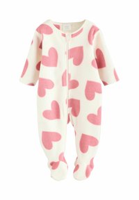 Combinaison en polaire pour bébé couleur crème avec un motif de cœurs roses ; comprend des manches longues, une fermeture éclair intégrale et un design avec pieds pour plus de chaleur.