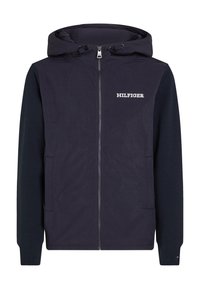Giacca con cappuccio blu navy, chiusura con zip, maniche a contrasto, tasche frontali e logo "HILFIGER" bianco sul petto. Tessuto liscio e leggero.