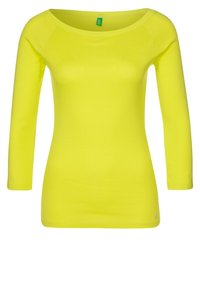 Dlouhý rukáv v jasné neonově žluté barvě, vyrobený z měkké, hladké tkaniny s kulatým výstřihem a přiléhavým střihem. Žádné viditelné vzory ani akcenty.