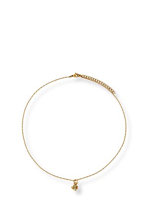 Delicate gold chain necklace with a small spaceship charm featuring colored enamel details, and an adjustable clasp.