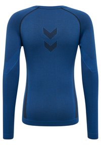 Långärmad atletisk topp i kungligt blått med en texturerad yta, med ett mörkblått chevronmönster på baksidan och en tight passform.
