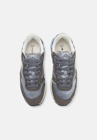Gray and light blue athletic shoes with a mix of mesh and suede materials. Features a padded collar, lacing system, and textured accents.