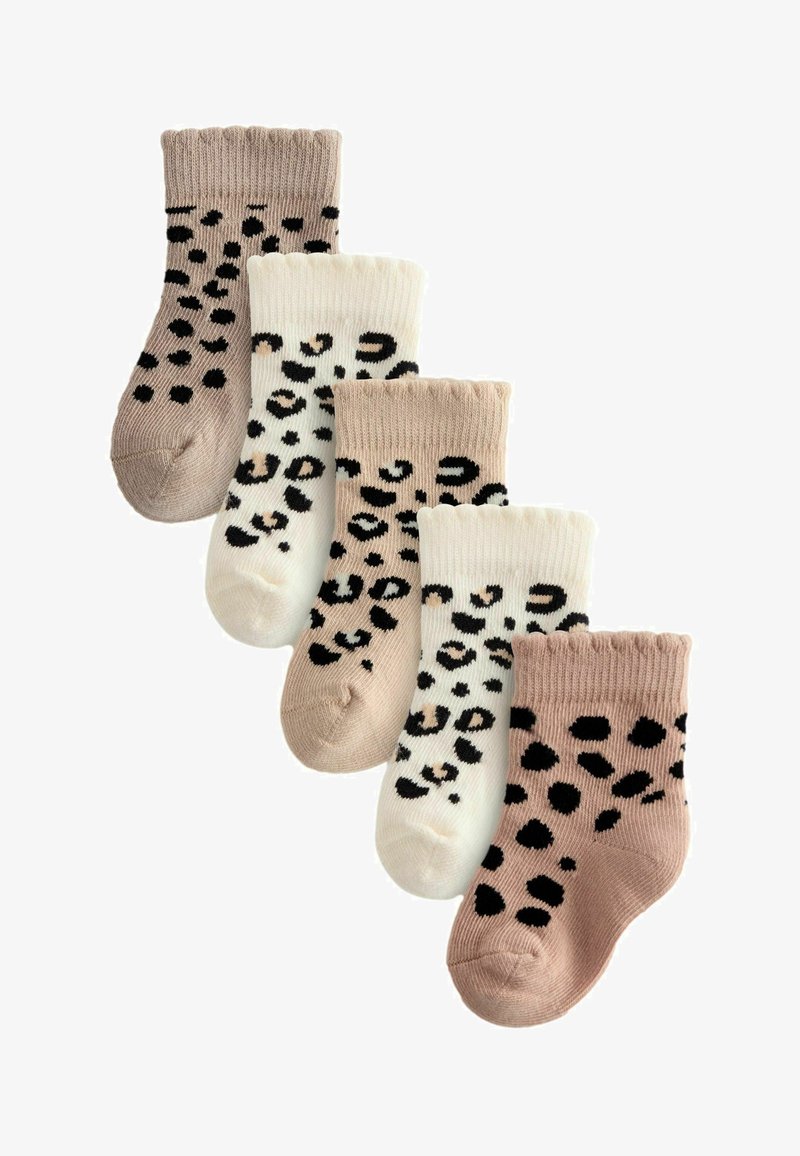 Set of four pairs of socks in soft knit; colors include beige and cream with black leopard spots and solid beige. Ribbed cuffs at the top.