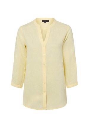 Jasnożółta, długi rękaw, koszula zapinana na guziki z dekoltem w serek i kołnierzykiem typu mandarynka, wykonana z lekkiego, półprzezroczystego materiału.