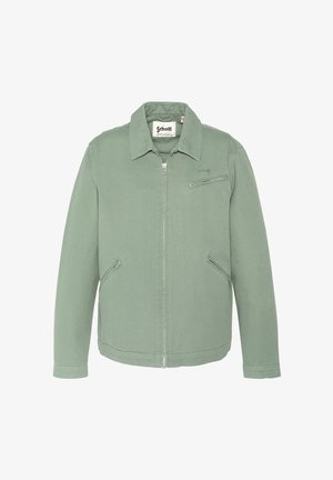 Veste zippée vert clair avec col, trois poches zippées, et logo "Schott" sur la poitrine et l'étiquette intérieure.