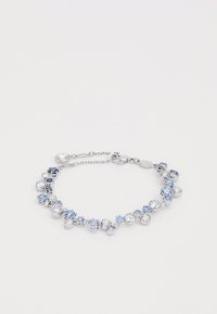 Silver bracelet featuring mixed blue and clear crystals in various sizes arranged in a circular pattern with a clasp.