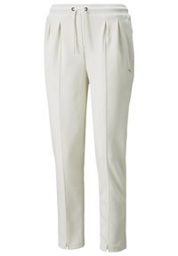 Vita joggerbyxor med en plisserad design, mjuk textur och elastisk midja. Har en liten grå logotyp på vänster sida.